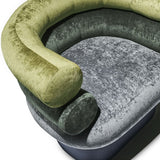 Interlude Home Leona Swivel Chair - Top View of Cushion and Armrests: A close-up, top-down view of the Leona swivel chair, highlighting the plush green and gray velvet upholstery and the unique cylindrical design of the armrests and seat cushion, emphasizing its comfort and modern aesthetic.