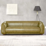 Ashcroft Green Marlon Luxury Italian Leather Sofa in a stylish living room setting, highlighting the comfortable and luxurious appearance.