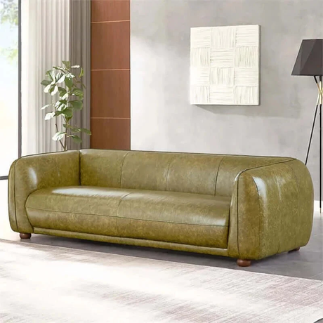 Side angle of the Ashcroft Marlon Luxury Italian Leather Sofa in green, featuring its smooth, curved lines and high-quality leather.