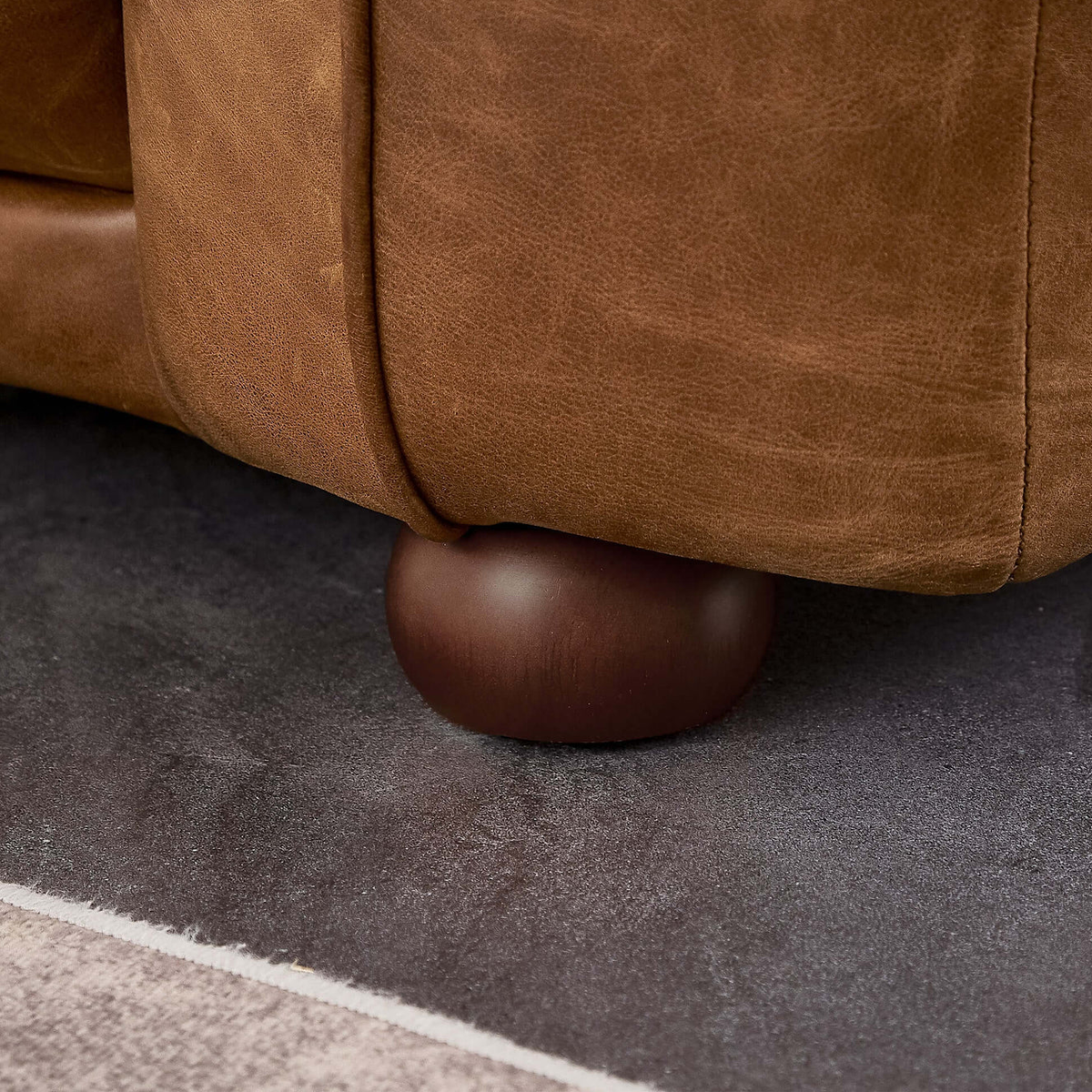 Close-up of the Brown Ashcroft Marlon Luxury Italian Leather Sofa's cushion, showing the fine leather quality and craftsmanship.